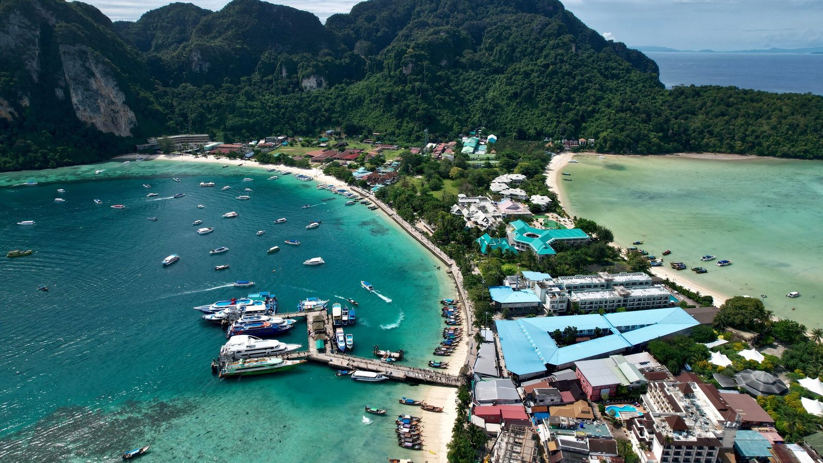 Aerial view of Koh Phi Phi Don's isthmus, with Ton Sai Bay and its pier on the left and Loh Dalum Bay on the right