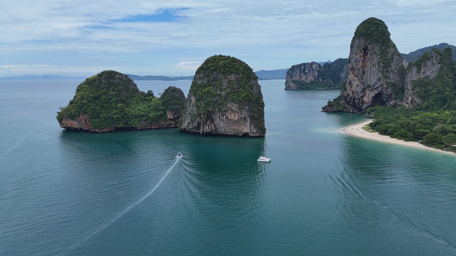 The limestone towers of the Railay peninsula from the air, with two islets offshore